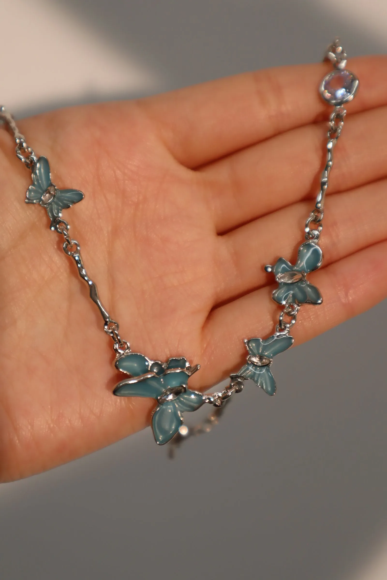 Platinum Plated Blue Butterfly Fluttering Necklace