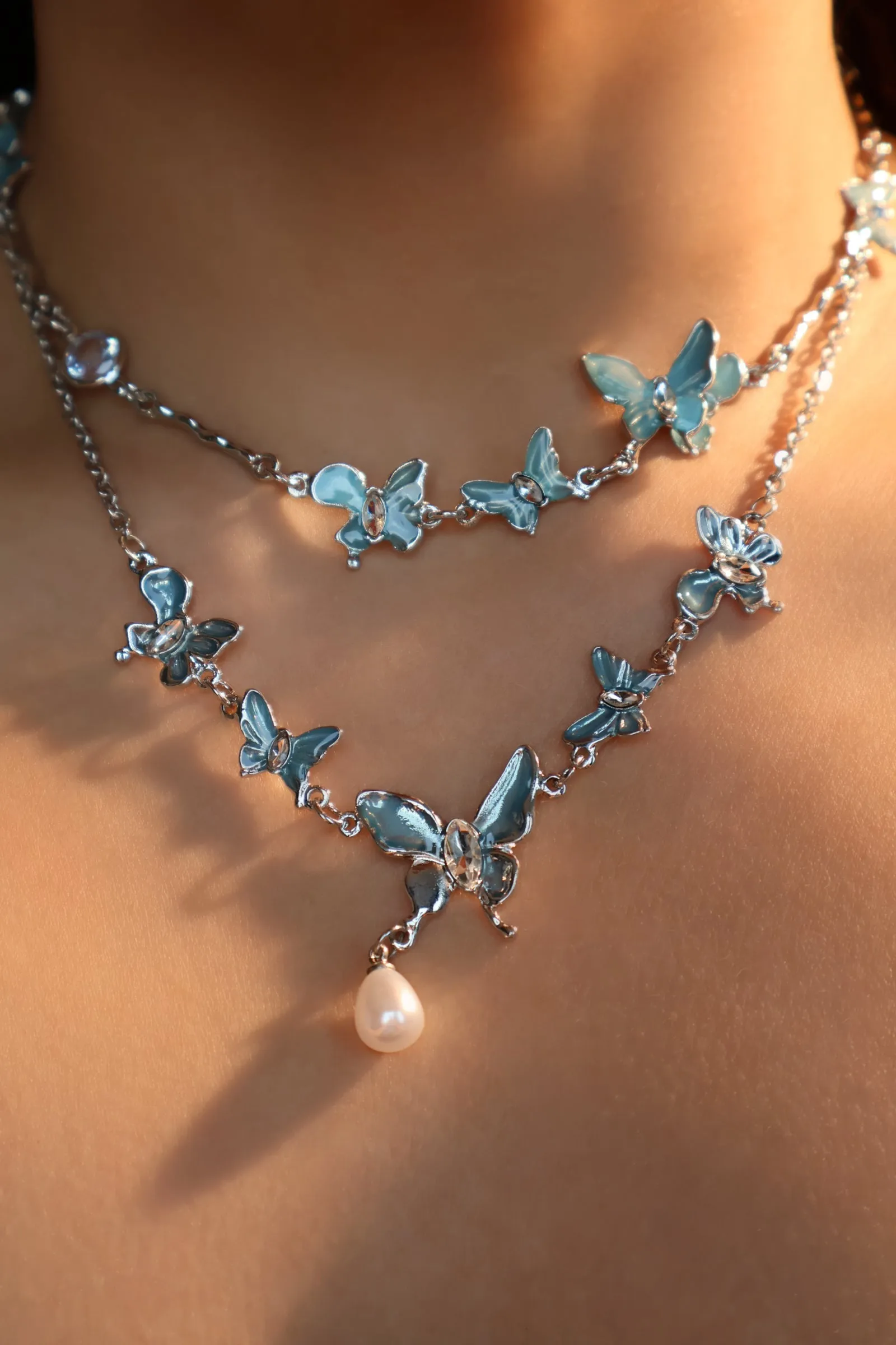 Platinum Plated Blue Butterfly Fluttering Necklace